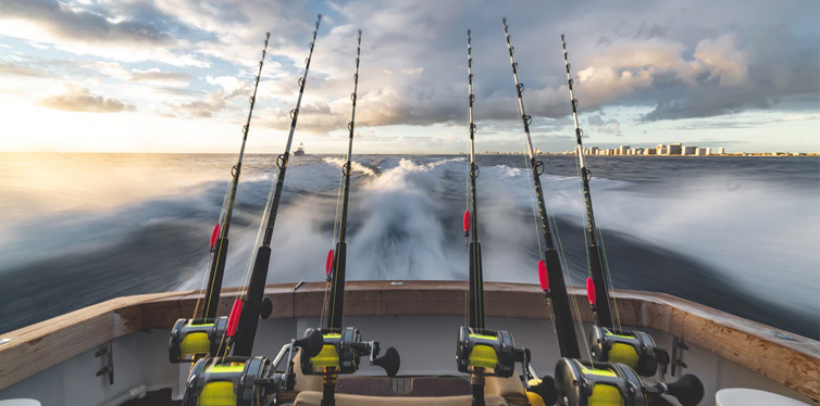 People sitting and waiting for fish to bite while fishing 